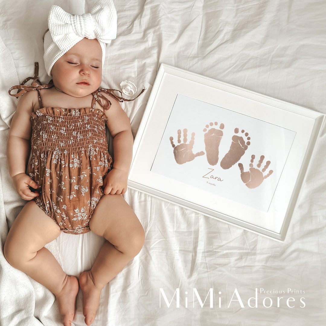 Framed hand and footprint keepsake created in rose gold foil. Two handprints and two footprints have been treasured in real foil to create a personalised baby keepsake.