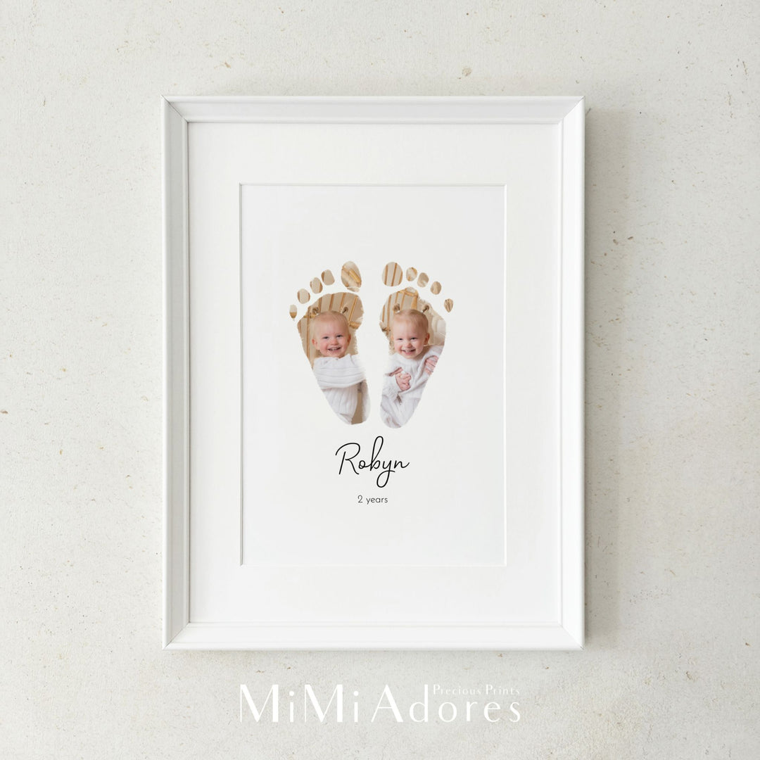 Toddler footprint art. The baby's foot prints has photos of the baby incorporated inside the feet to make a unique and personalised keepsake.